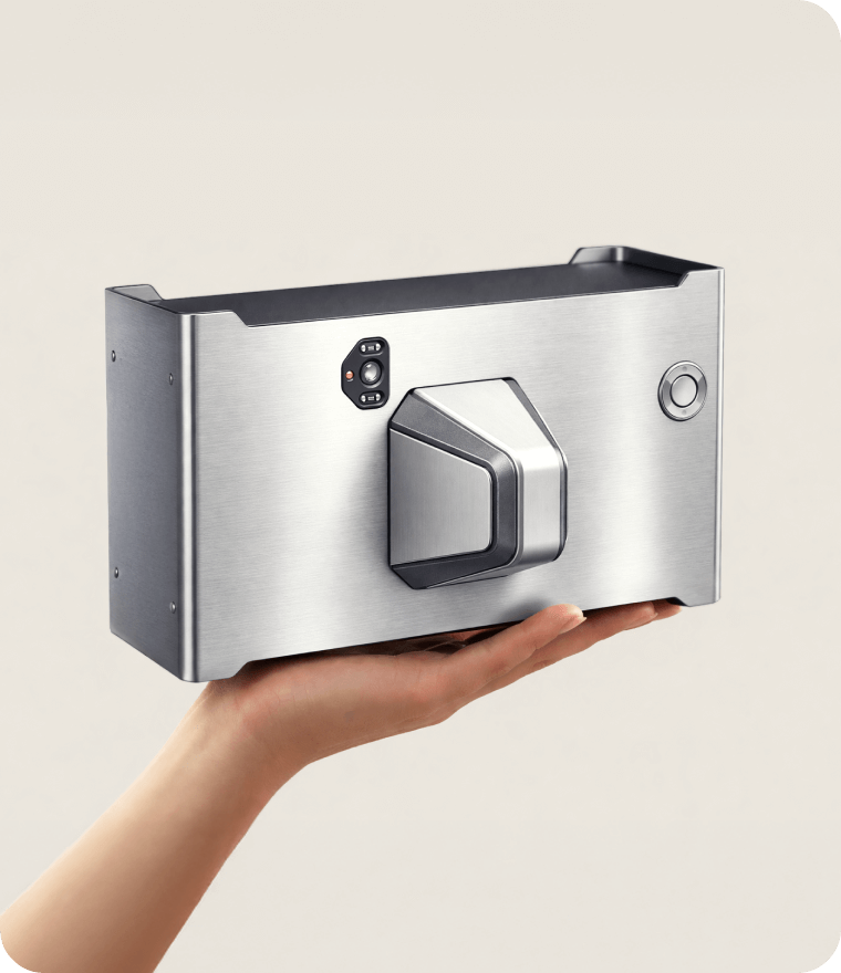 Hand holding weapon detection technology against a beige background