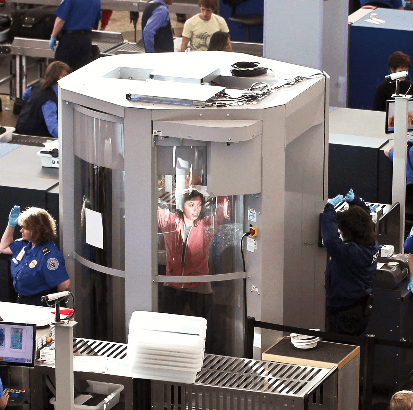 Person going through airport security screening